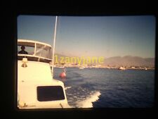 3s19 Vintage Photo 35mm Slide Large Boatsmall Yacht Open Water Bouy Hills Shore